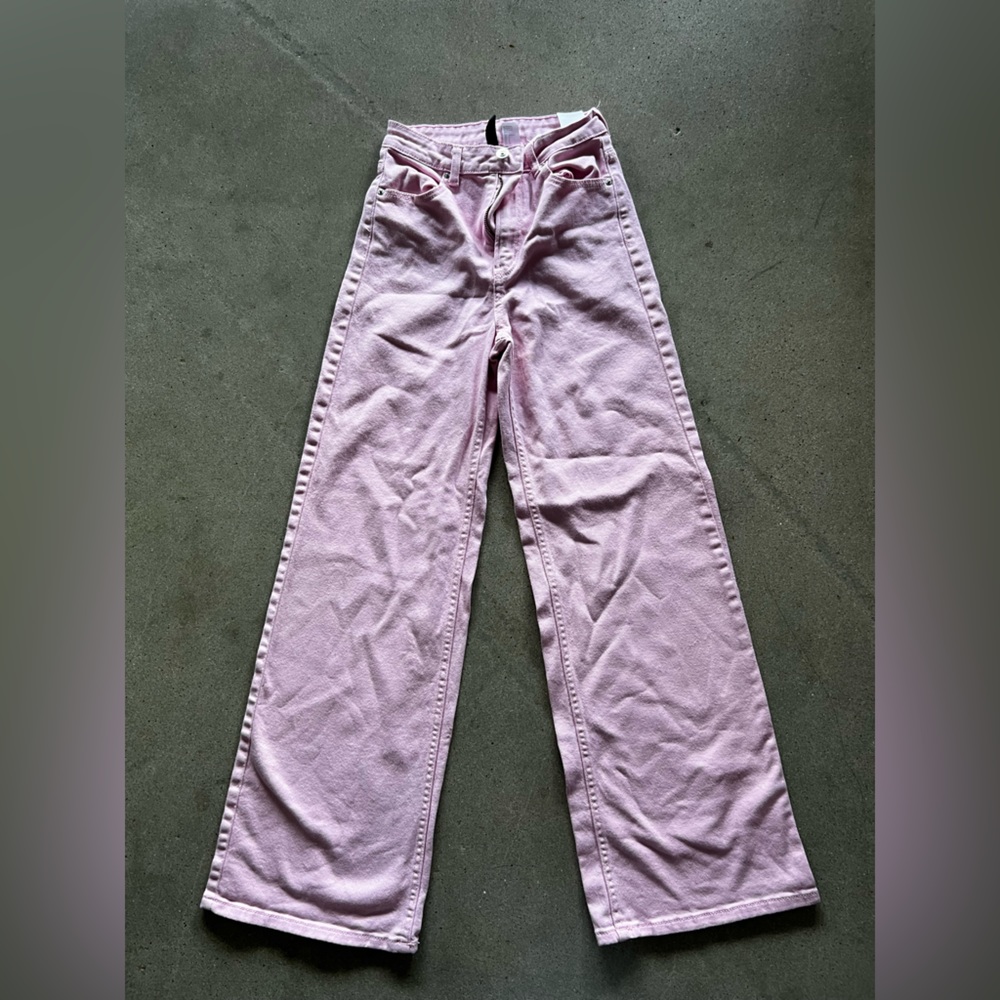 Divided women jeans size 2. Pink color. Wide or flare leg. Slightly used.